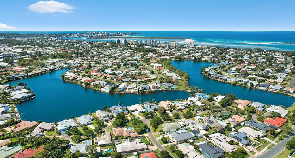 Pelican-Waters-flies-high-1024×549-1